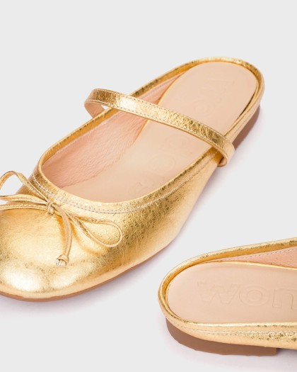 Close-up of the LULU 02 ballerina flats in metallic gold leather with a bow detail and upper strap.